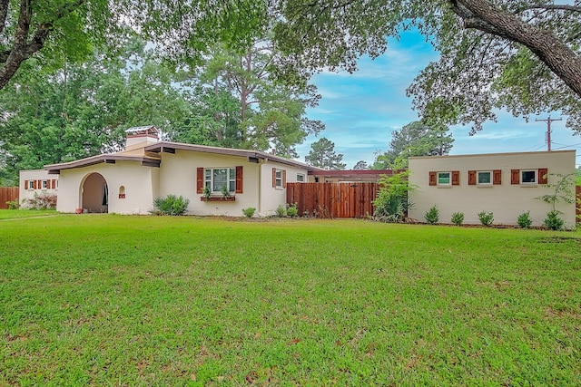 exterior space with a front lawn