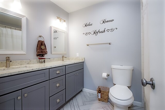 bathroom with vanity and toilet