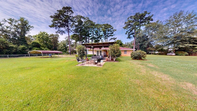 view of yard featuring a patio area and a carport