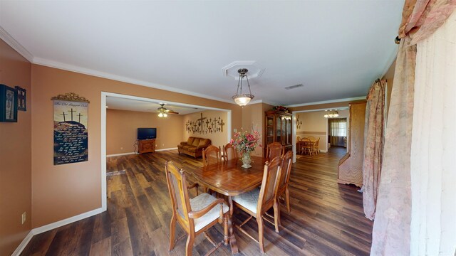 dining room with crown molding, ceiling fan, and dark hardwood / wood-style floors