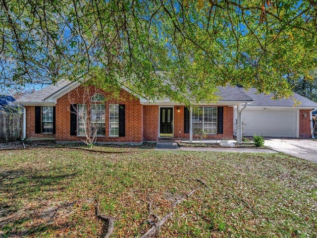 ranch-style home featuring a front lawn and a garage