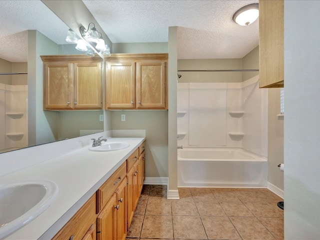 bathroom featuring tile patterned floors,  shower combination, vanity, and a textured ceiling