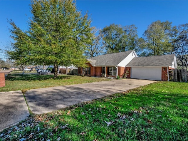 single story home featuring a garage and a front lawn