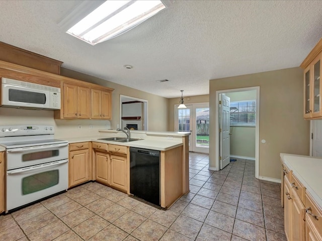 kitchen featuring sink, hanging light fixtures, kitchen peninsula, white appliances, and light brown cabinetry