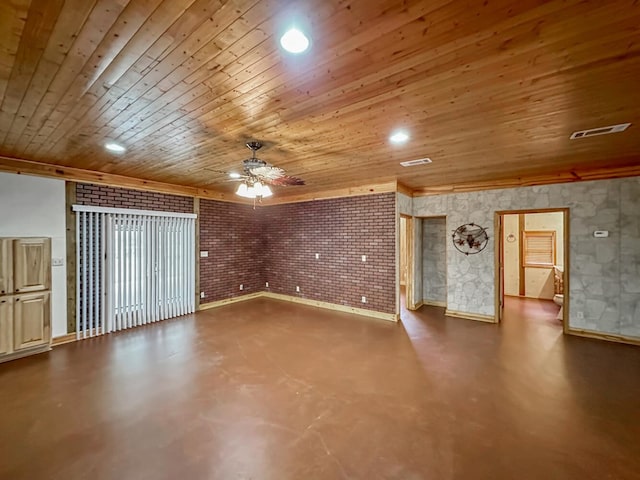 unfurnished living room featuring ceiling fan, wooden ceiling, brick wall, and concrete floors