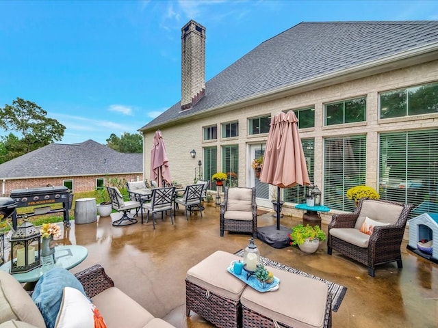 view of patio with an outdoor hangout area and grilling area