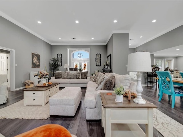 living room with dark hardwood / wood-style floors and ornamental molding