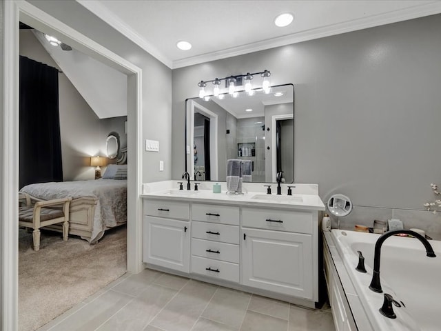 bathroom with tile patterned flooring, vanity, ornamental molding, and a washtub