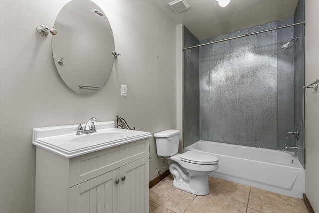 full bathroom featuring tile patterned flooring, vanity, toilet, and tiled shower / bath