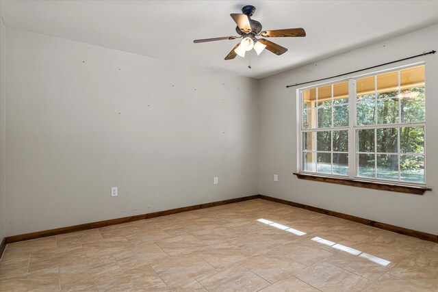 unfurnished room featuring ceiling fan