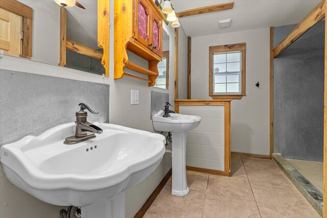 bathroom featuring tile patterned flooring and double sink