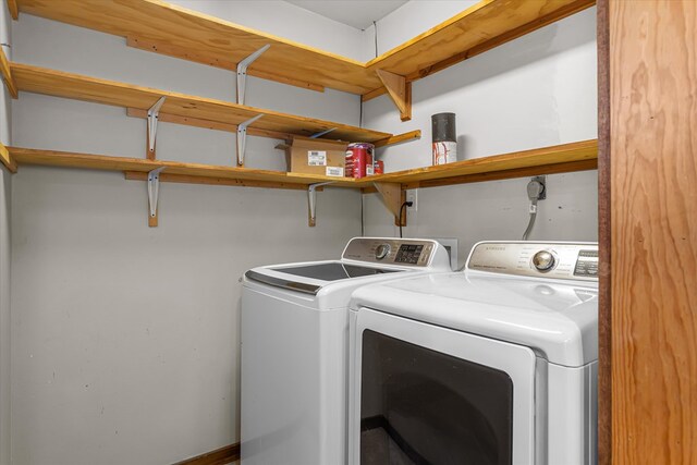 clothes washing area with independent washer and dryer