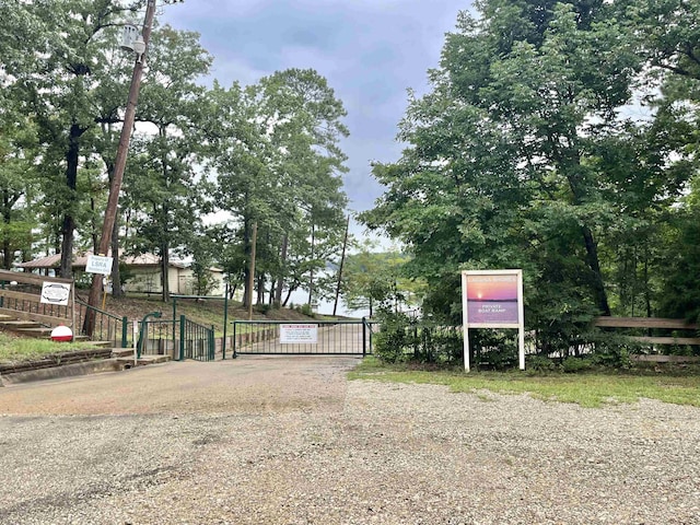 view of gate featuring fence