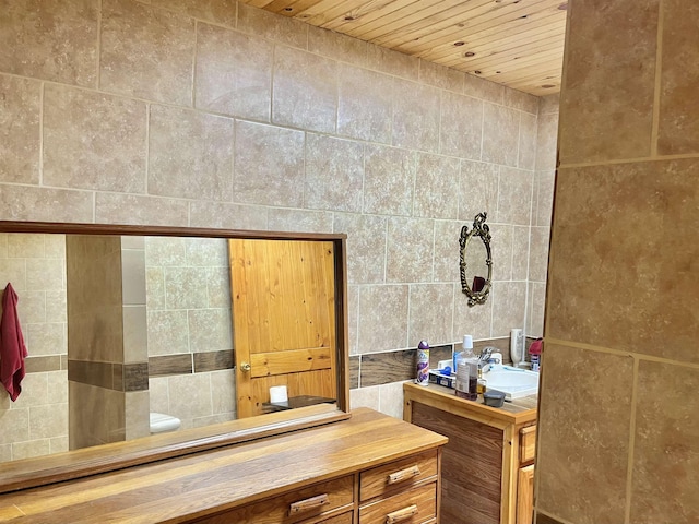 bathroom featuring wooden ceiling and vanity