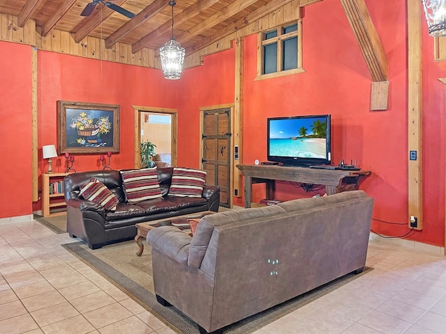 tiled living room with wood ceiling, ceiling fan, baseboards, and beam ceiling