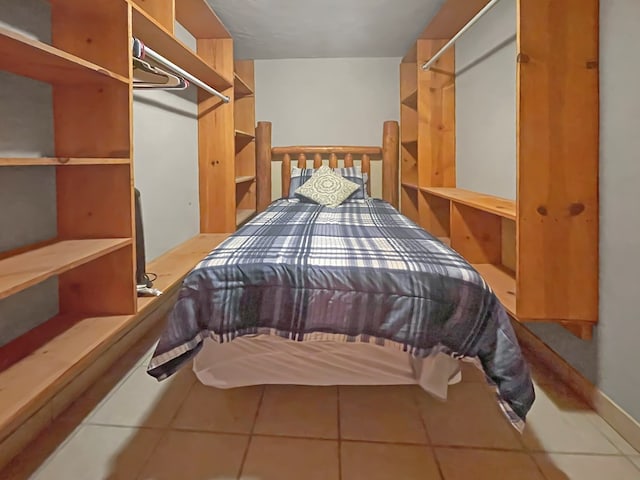 bedroom with tile patterned floors