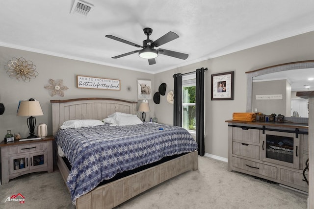 538 Timpson St, Timpson, TX 75975 - bedroom featuring light colored carpet, a ceiling fan, ornamental molding, and visible vents
