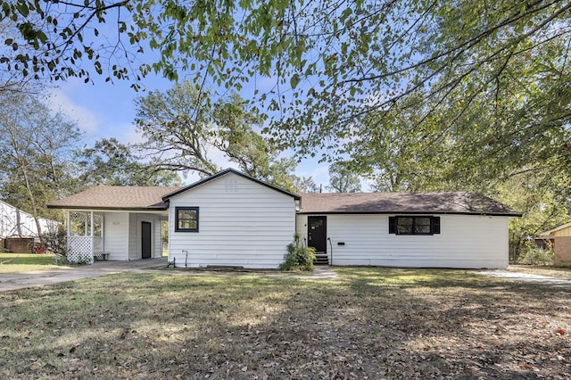 ranch-style home with a front lawn