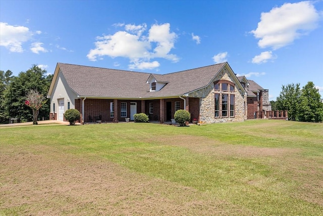 view of front of house with a garage and a front lawn