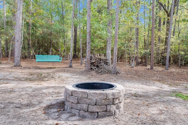 exterior space with an outdoor fire pit