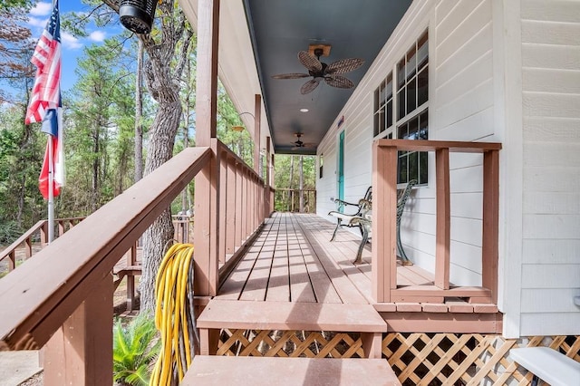 wooden deck with ceiling fan and a porch