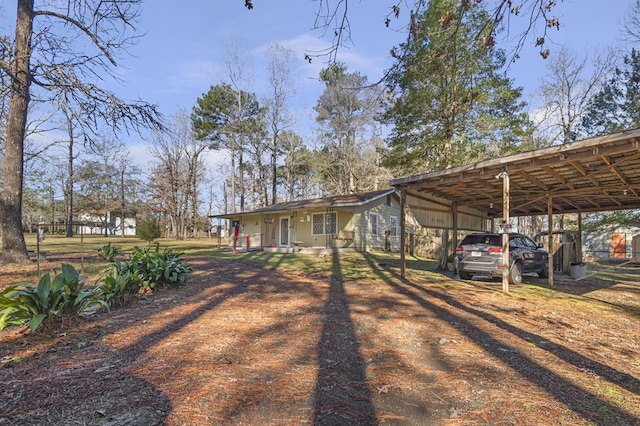 view of front of home featuring a carport