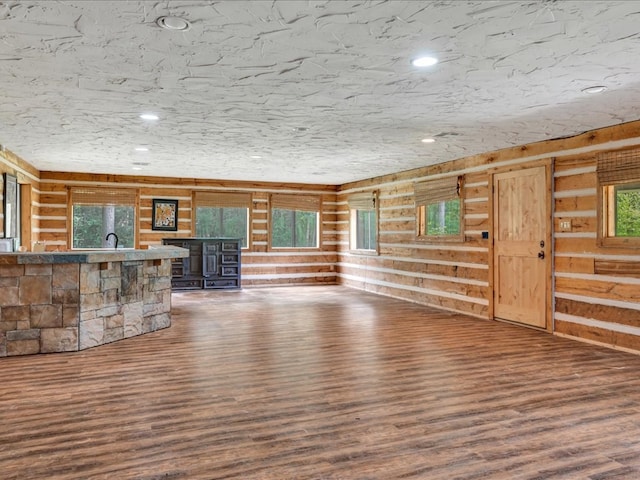 2104 Brentwood Dr, Lufkin, TX 75901 - unfurnished living room with wood finished floors, recessed lighting, and wooden walls