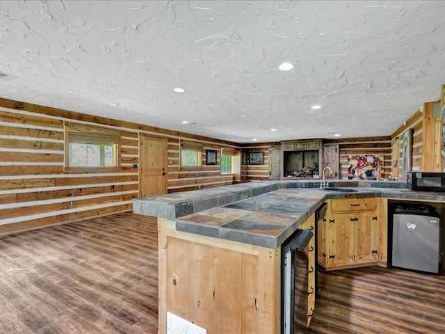 2104 Brentwood Dr, Lufkin, TX 75901 - kitchen featuring black microwave, beverage cooler, dark countertops, dark wood-style flooring, and recessed lighting