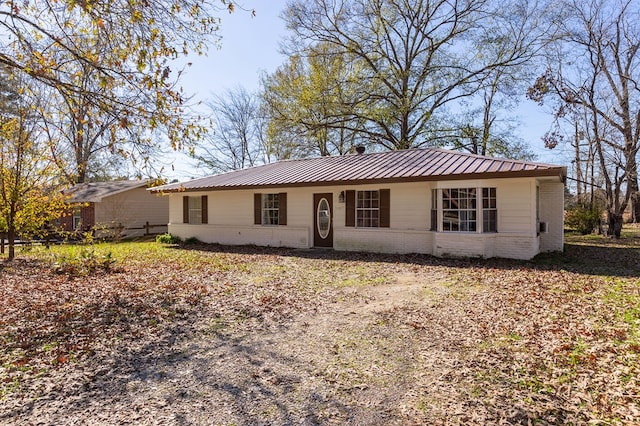 1407 Fairchild Dr, Diboll, TX 75941 - ranch-style home featuring brick siding and a metal roof