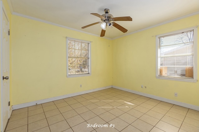 tiled spare room with ceiling fan and ornamental molding