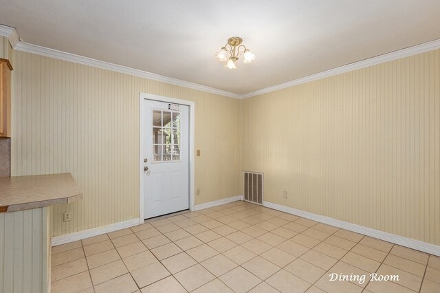 interior space featuring light tile patterned floors, a notable chandelier, and ornamental molding