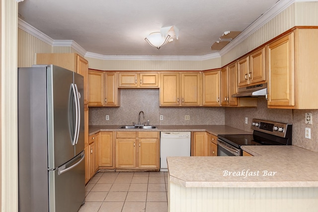 kitchen with kitchen peninsula, appliances with stainless steel finishes, ornamental molding, sink, and light tile patterned floors