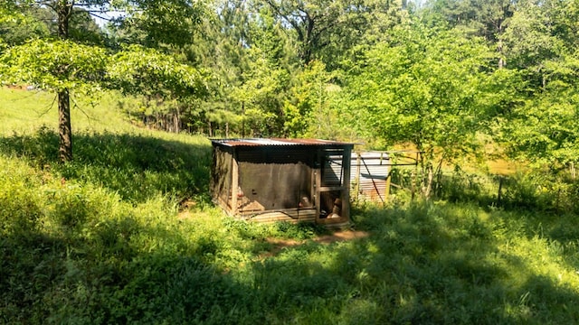 914 County Road 849, Cushing, TX 75760 - view of poultry coop featuring a forest view