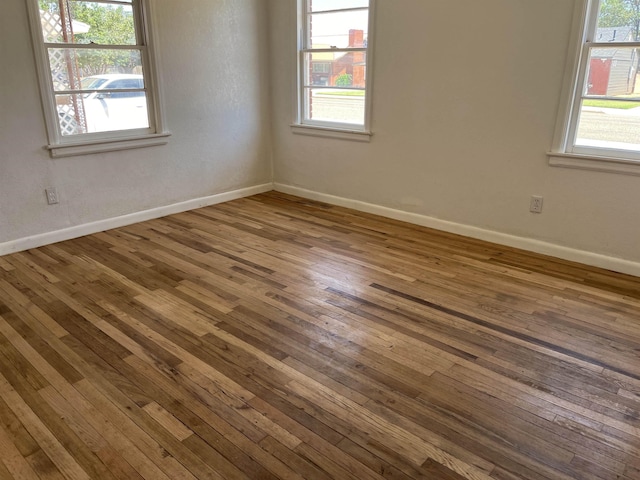 spare room featuring hardwood / wood-style floors