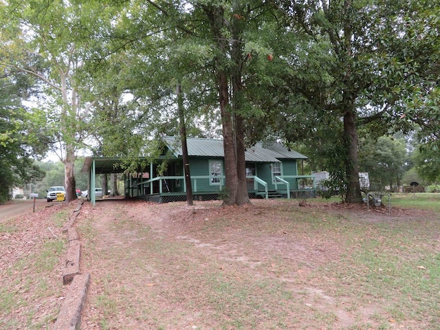 view of front of property featuring a carport