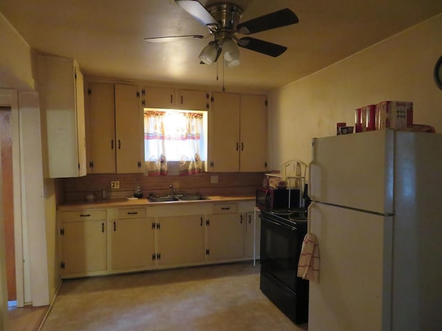 kitchen featuring sink, backsplash, white fridge, electric range, and ceiling fan