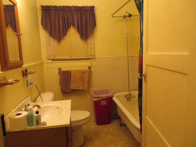 full bathroom with vanity, separate shower and tub, and toilet