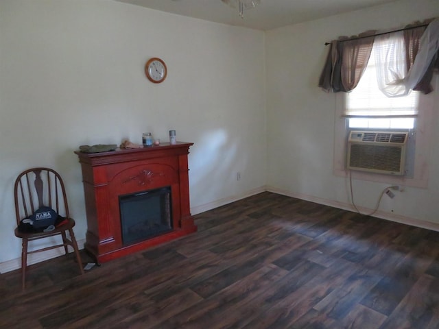 unfurnished living room with cooling unit and dark hardwood / wood-style floors