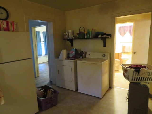 laundry area featuring washing machine and clothes dryer