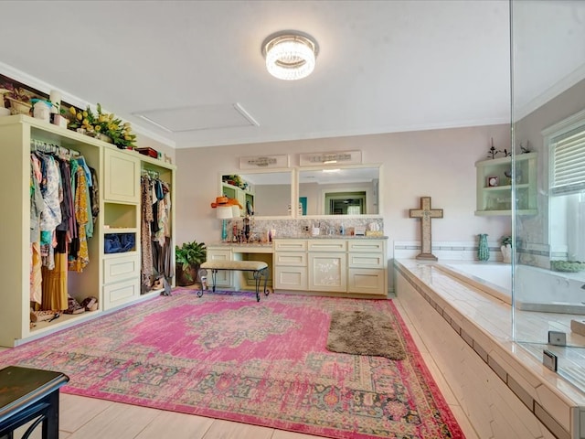 1145 State Highway 21e, San Augustine, TX 75972 - full bathroom featuring a spacious closet, a garden tub, crown molding, and vanity