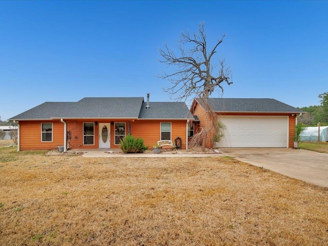 ranch-style house with a garage and a front yard