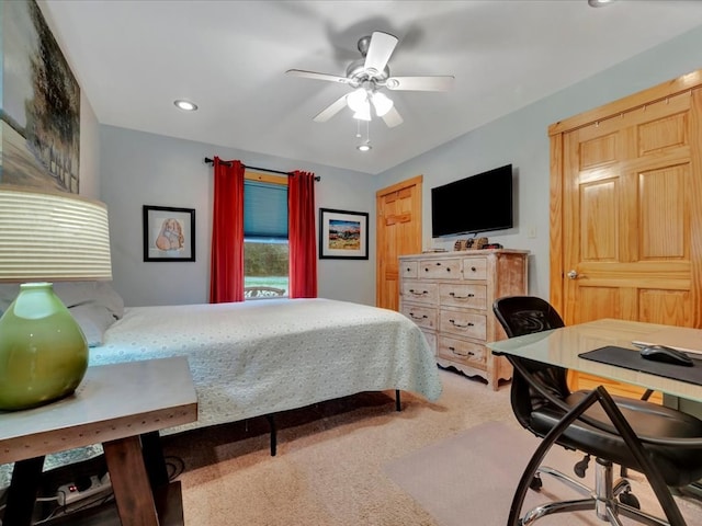 carpeted bedroom with ceiling fan