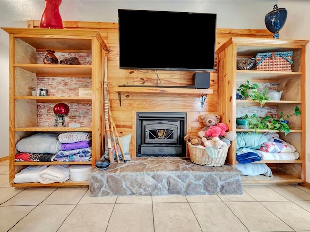 tiled living room featuring a wood stove