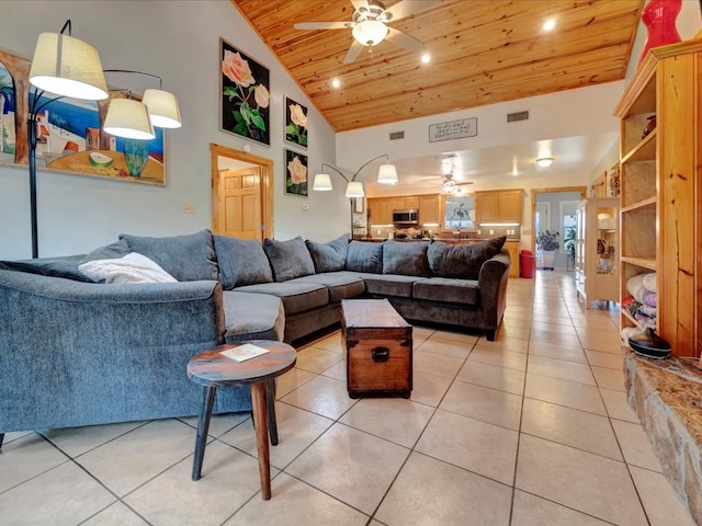 tiled living room with ceiling fan, wooden ceiling, and high vaulted ceiling