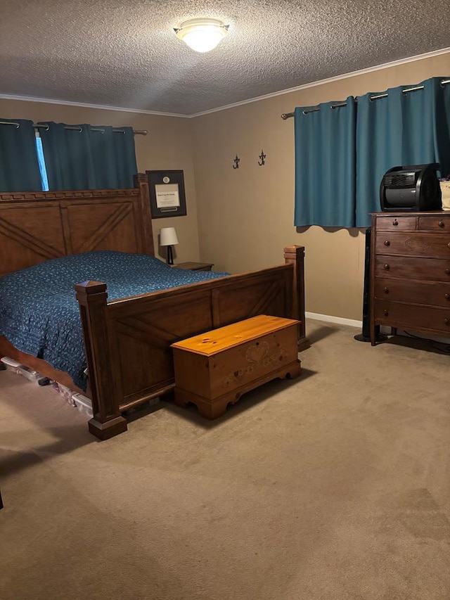 bedroom with crown molding, light colored carpet, and a textured ceiling