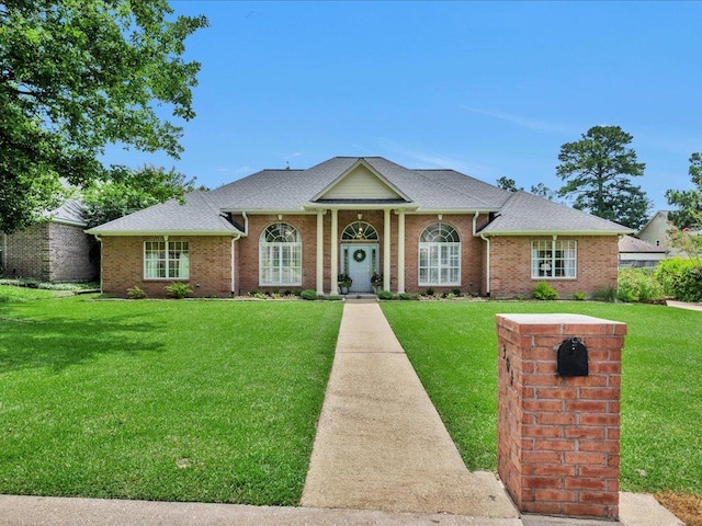 301 Sawgrass Cir, Lufkin, TX 75901 - greek revival inspired property with a front yard and brick siding