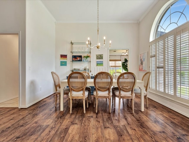 301 Sawgrass Cir, Lufkin, TX 75901 - dining area featuring a chandelier, crown molding, and wood finished floors