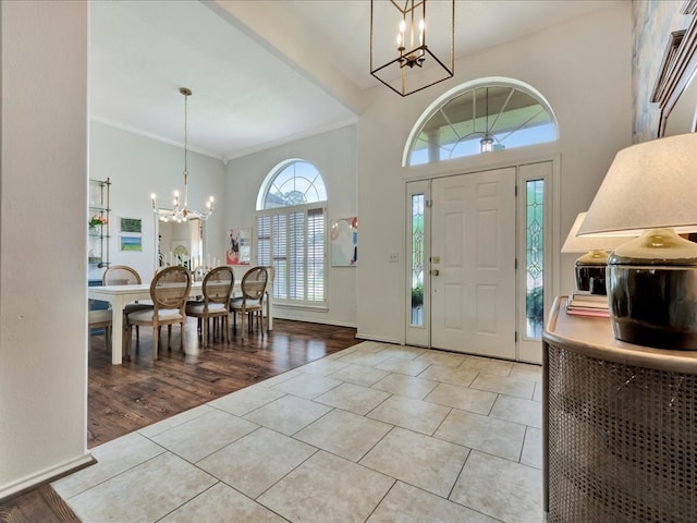 301 Sawgrass Cir, Lufkin, TX 75901 - tiled entryway with a chandelier and baseboards