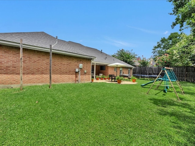 301 Sawgrass Cir, Lufkin, TX 75901 - fenced backyard with a patio area and a trampoline