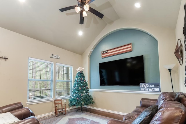 living room with ceiling fan and vaulted ceiling